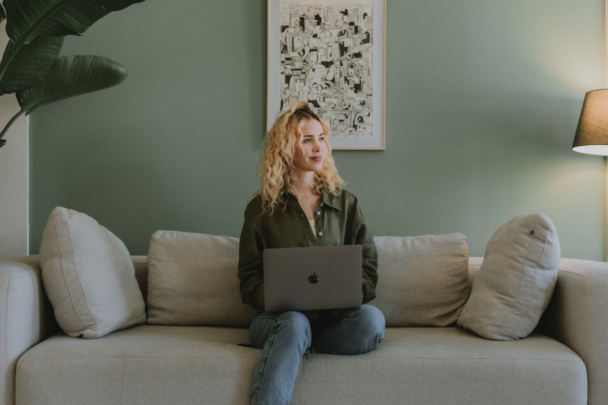 Blonde blogger sitting with a laptop